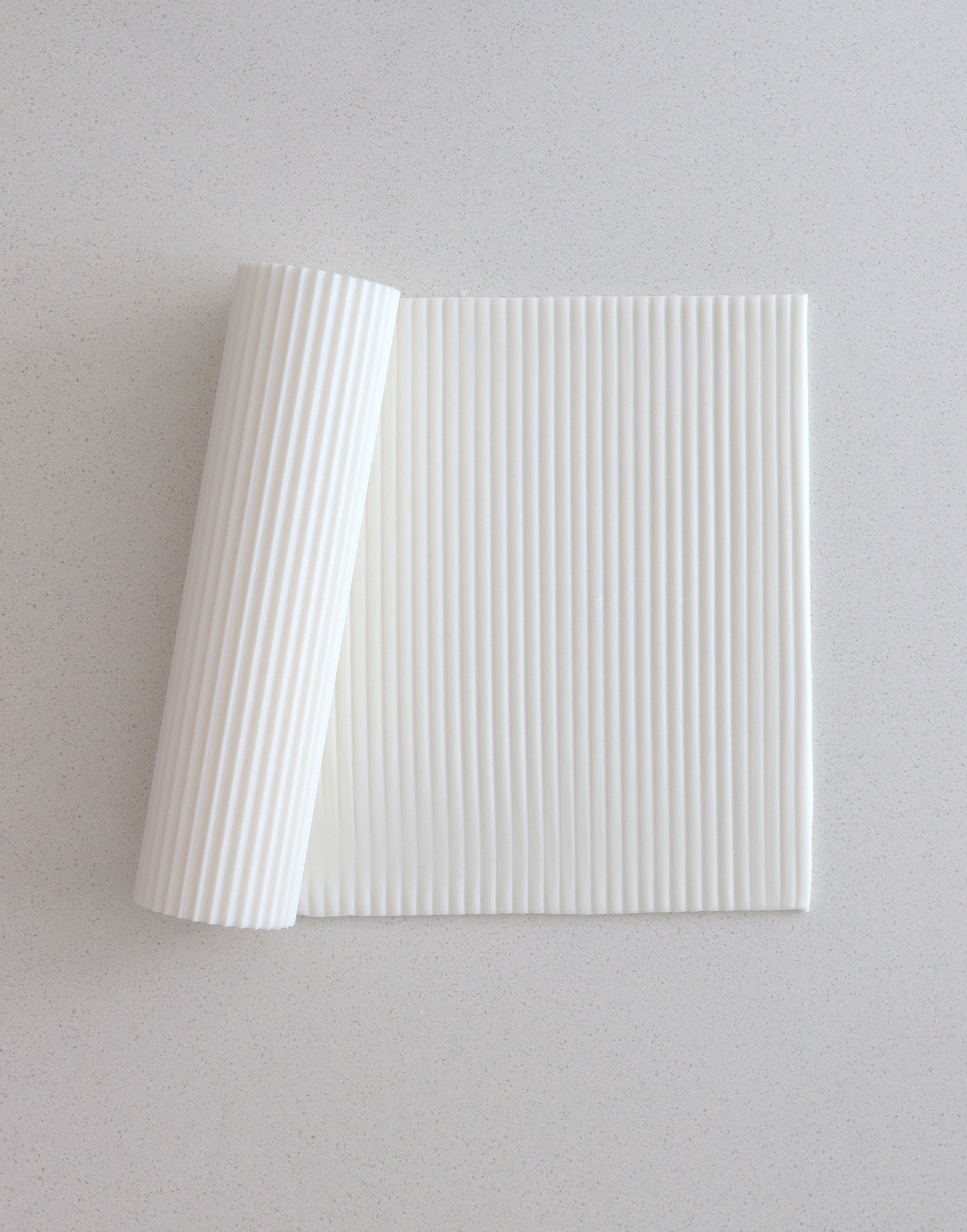Prop Options Reeded texture rolling pin pressing a clean ridged pattern into fondant