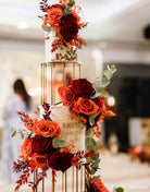 Gold birdcage metal cake separators used in a tall floral wedding cake display by Prop Options