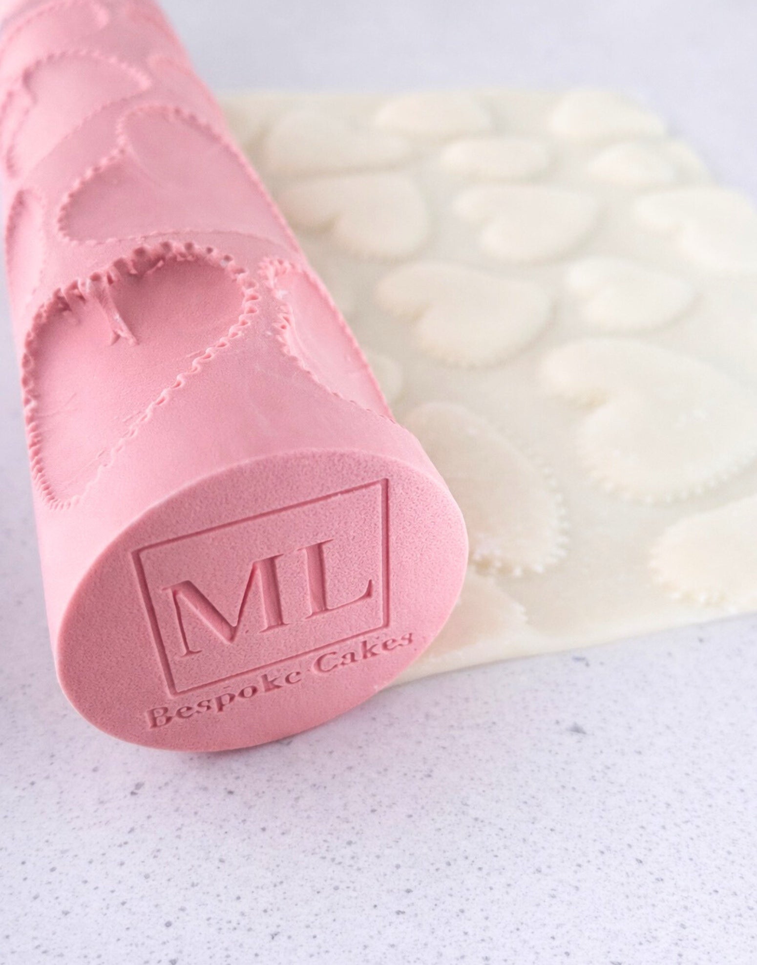 Hearts texture rolling pin by ML Bespoke Cakes creating stitched heart pattern on fondant