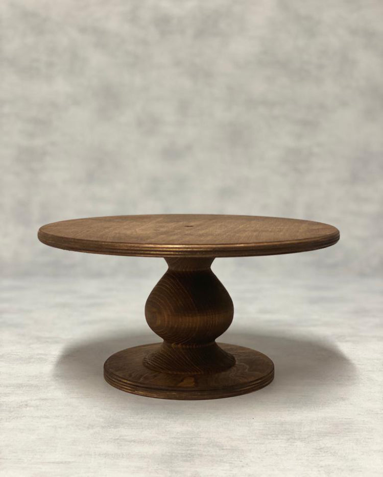 The Teardrop Scandinavian Birch Cake Stand standard size in a dark finish - Prop Options